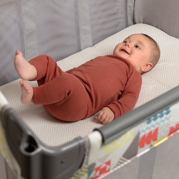 Baby laying on the removable bassinet of Graco's Contour Electra