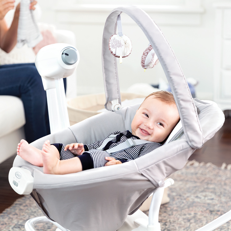 Little baby enjoying one of the recline positions of Graco's Duet Sway