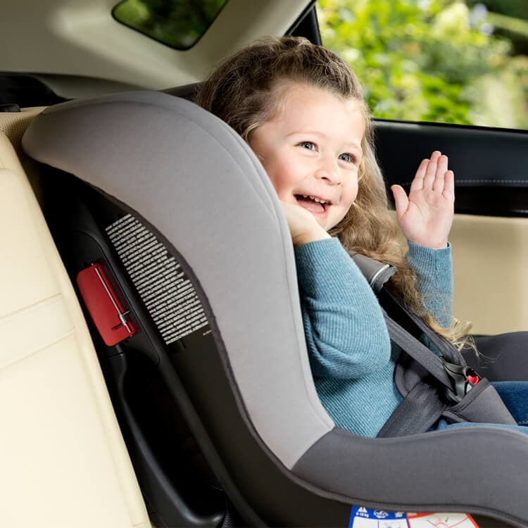 Young girl sitting forward facing in Graco Extend car seat